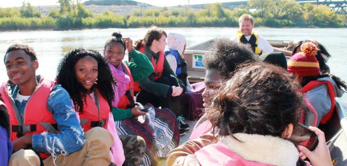 Green Works students in a boat during a field trip.
