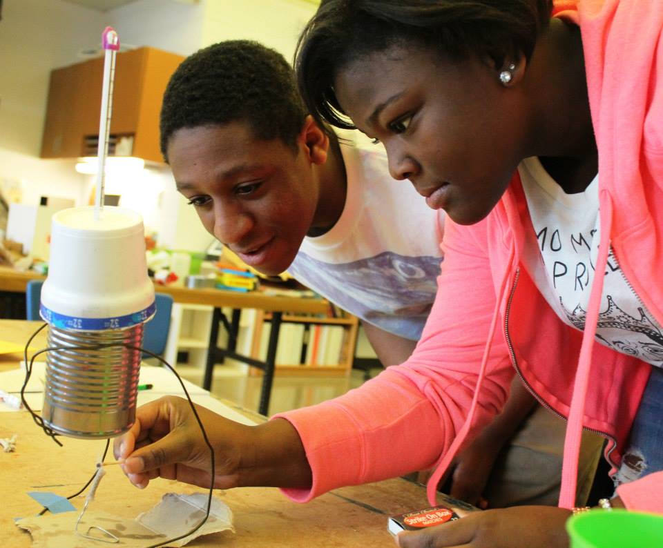 Two Green Works students doing an experiment.