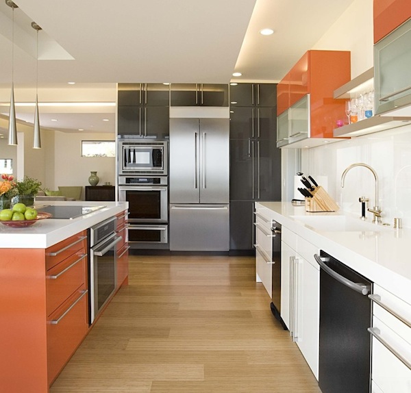 A light hardwood floor adds space to a galley kitchen makeover.