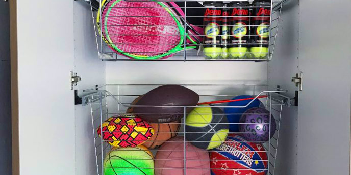 Metal Bins on Rollers Filled With Sports Gear