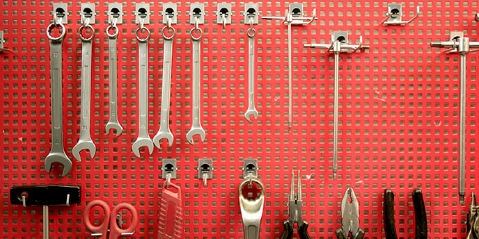 Red Pegboard for Tool Storage in the Garage