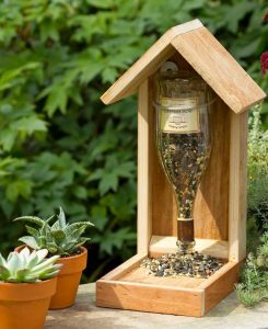 A Wine Bottle Reused as a Birdfeeder. 