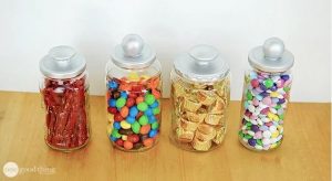 Alt text: Reusing Glass Jars as Candy Jars With Silver Lids.