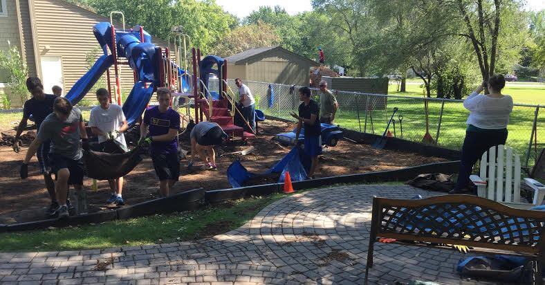 Eastview High School Boys Cross Country Team at Work on Playground