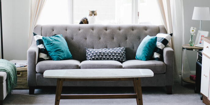 Image of a Sofa Being Set Up After a Move