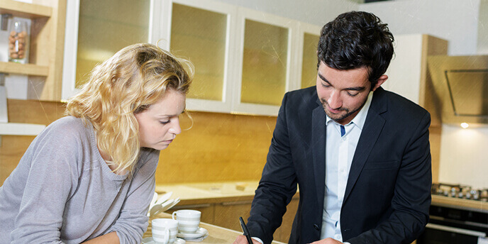 Woman Getting an In-Home Written Estimate