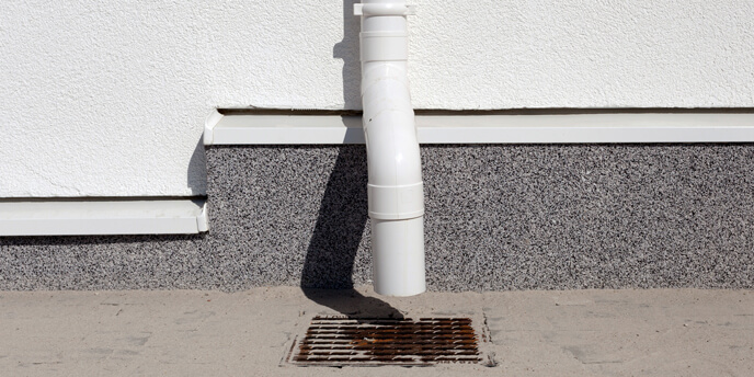Downspout Attached to the Side of a House
