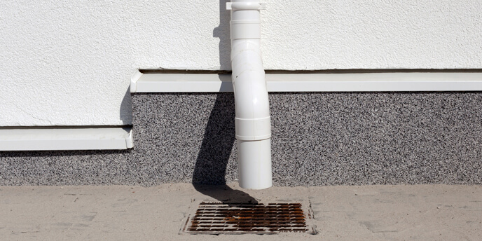 Downspout Attached to the Side of a House