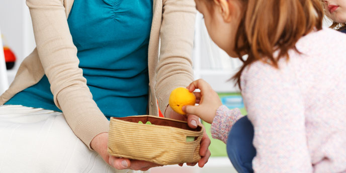 Child Playing Cleanup Game with Mother