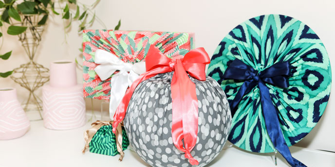 Four Differently Shaped Gifts In Lily Wrap