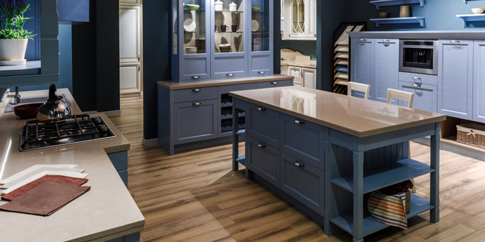 Dresser Turned Kitchen Island in the Center of a Blue Kitchen