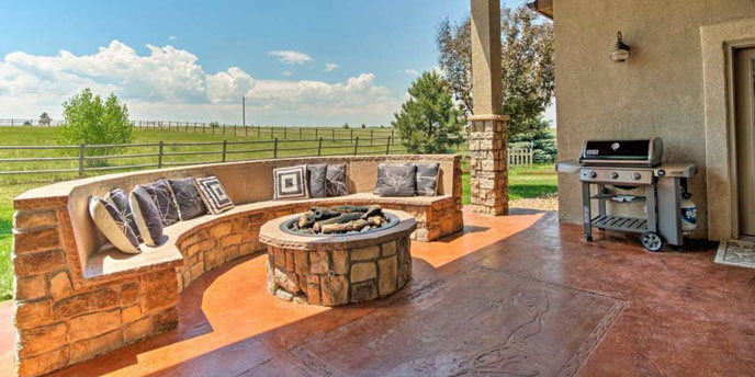 Outdoor Patio With Fire Pit at Colorado Springs Vacation Lodge Airbnb
