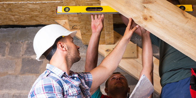 DIY Team Finishing a Basement Staircase