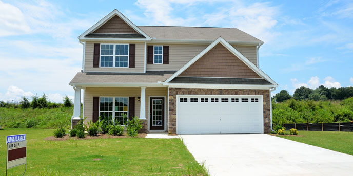 Residential Home For Sale on Bright, Sunny Day Under Blue Skies