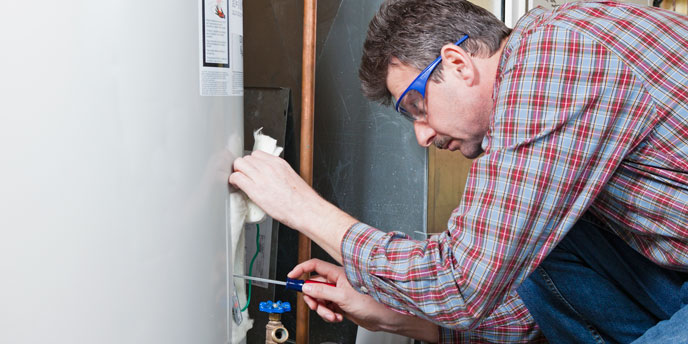 Hot Water Heater Being Examined by Repairman