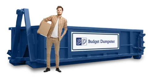 Man standing in front of 10 yard dumpster