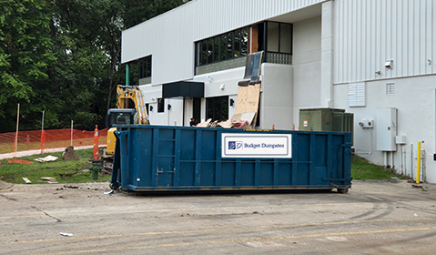 Roll Off Dumpster Filled With Construction Materials