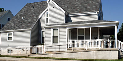 Grey House With Wheelchair Ramp