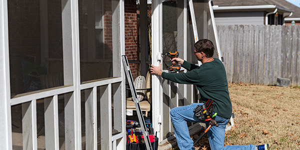 Man Installing a Porch Screen