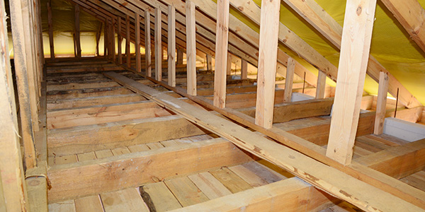 Unfinished Attic With Wooden Trusses