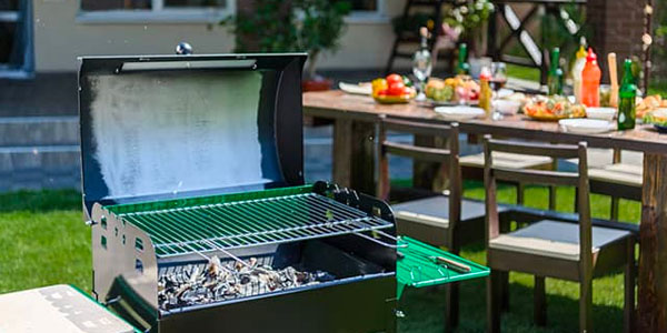 Backyard Grill With Table Set for BBQ