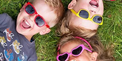Kids Playing Outdoors with Colorful Sunglasses On