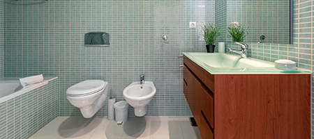 Blue Glass Tile on Wall in Bathroom With Vanity