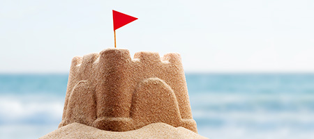 Sand Castle With Little Flat at the Beach