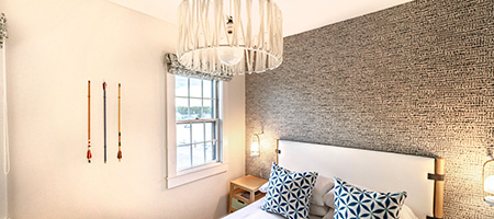 Crystal Chandelier Hanging Above a Bed