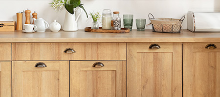 Buffet With Glasses, Cookware and Flowers