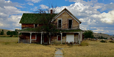 Old Wood Farmhouse Against Blue Sky