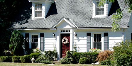 White Cape Cod Style Home: Symmetrical, Coastal Charm