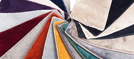 Layered Samples of Carpet in Different Colors