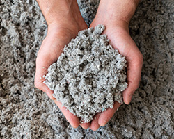 Hands Holding Cellulose Insulation