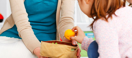 Child Playing Cleanup Game with Mother