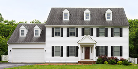 White Colonial Style Home With Garage: Symmetrical, Historic Charm.