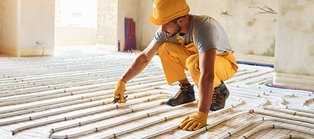 Contractor Installing a Radiant Heating Floor