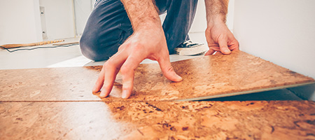 Man Installing Cork Flooring