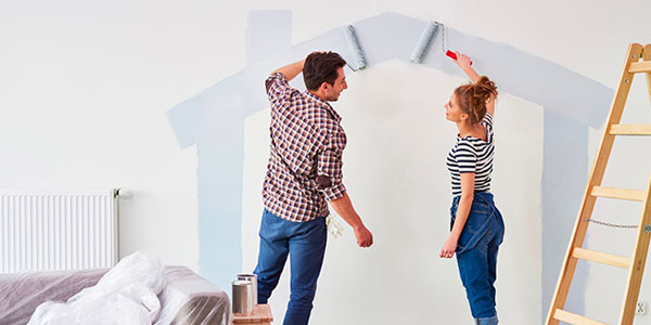 Couple Painting a Wall