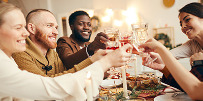 Happy Holiday Party In Decorated Dining Room