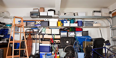 Messy Garage With Ladder and Shelves