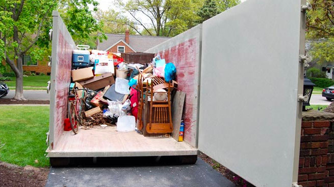 Dumpster Filled With Household Junk