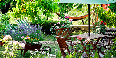 Garden With Flowers, Table and Chairs