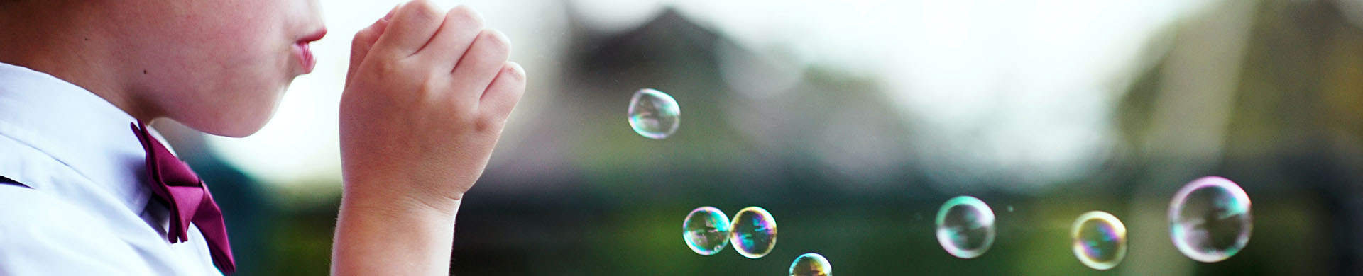 Young Boy Blowing Bubbles