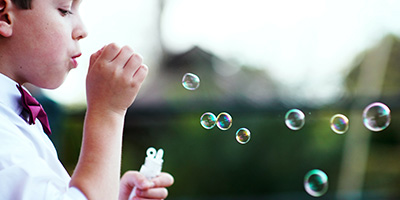 Boy Blowing Bubbles