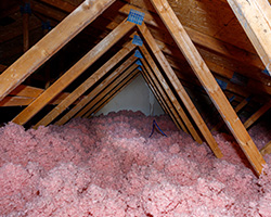 Fiberglass Loose Fill Insulation in Attic