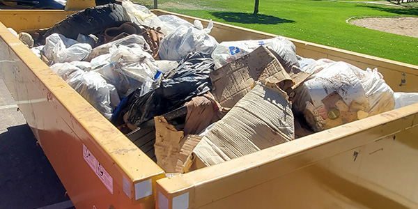 Full Dumpster Next to Fountain Creek