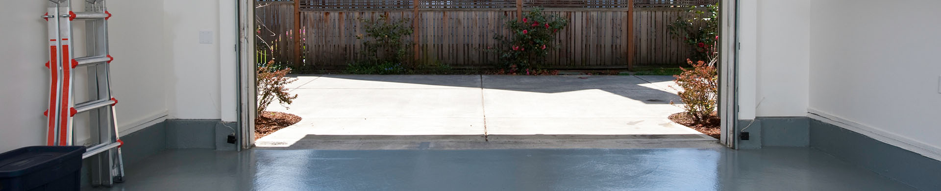 Clean Garage With Door Open to Driveway