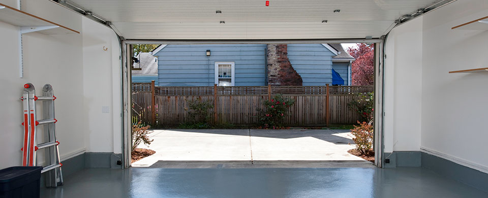 Clean Garage With Door Open to Driveway