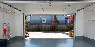 Clean Garage With Door Open to Driveway